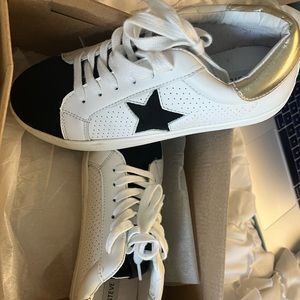Steve Madden gold and black star sneakers